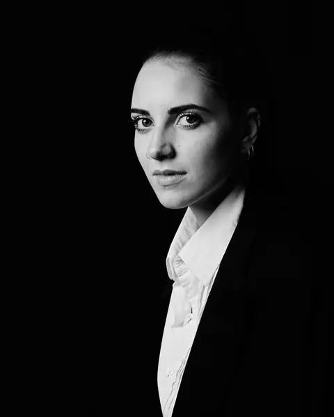 Portrait of Maya Crane in a dark suit