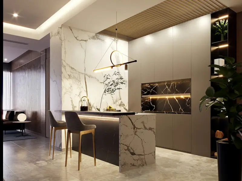 A show kitchen with a veined marble counter and a bronze pendant light